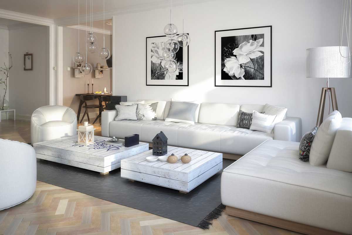 Soggiorno bianco moderno. Divano e parete bianca con due quadri a contrasto neri